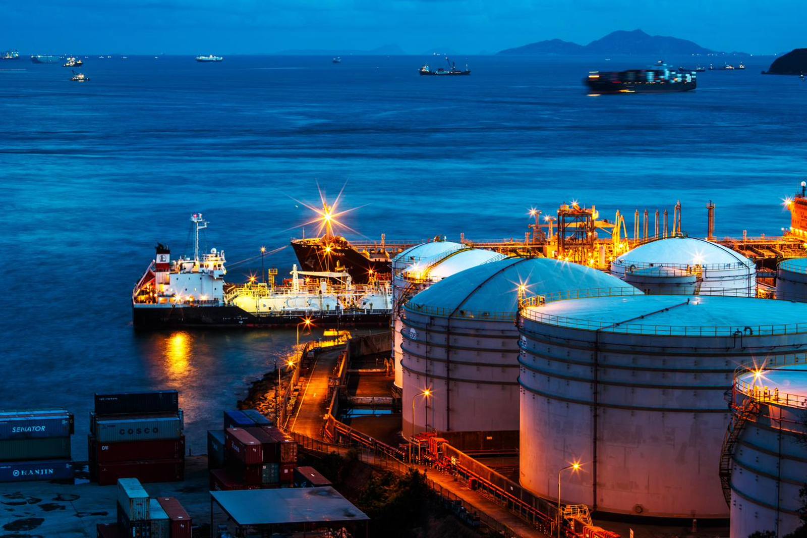 Bulk fuel storage terminal and tanker berth at dusk